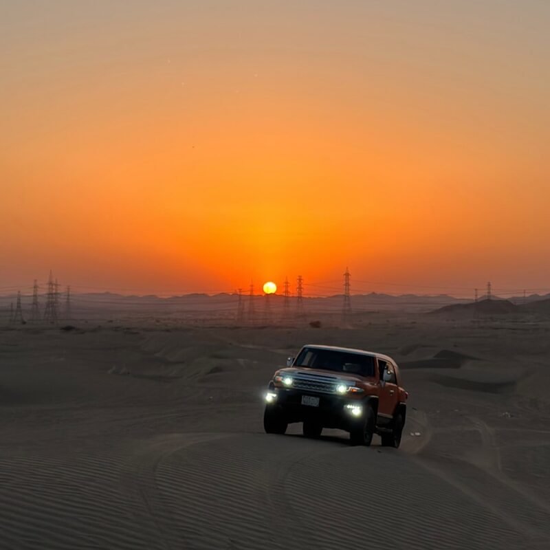 FJ Cruiser at sunset with a glowing orange sky